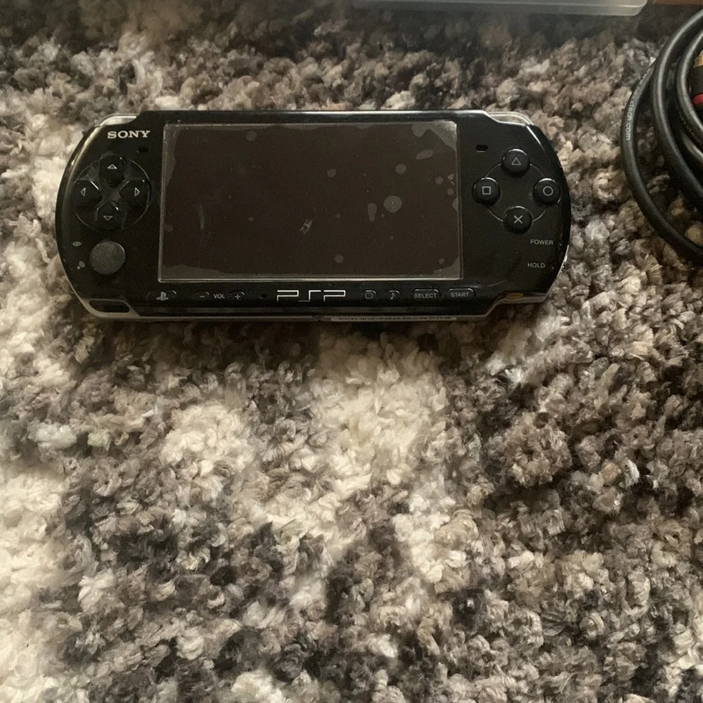 PSP Bundle with 7 games + case and extra disc holder and TV cables
